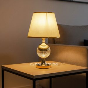 Golden Metal Table Lamp with Acrylic Design and Cream Plastic Shade